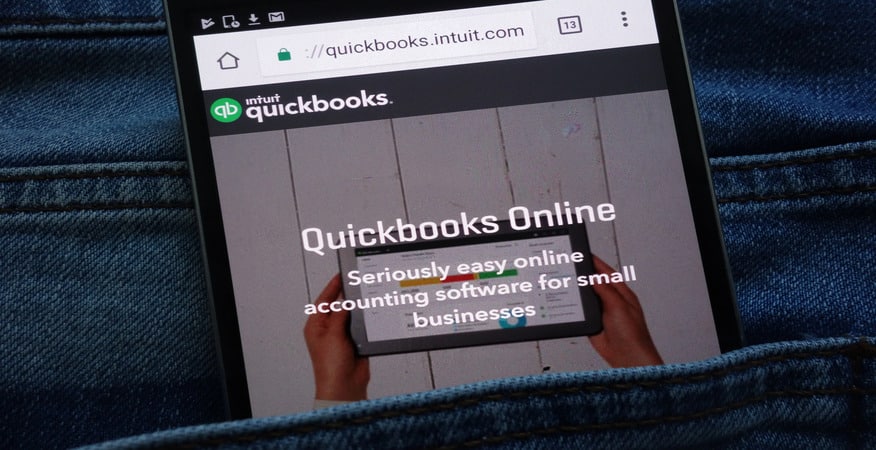 QuickBooks Online shown on a smartphone highlights key differences in cleaning up QuickBooks Online vs Desktop for Denver businesses using DK/RK Services.