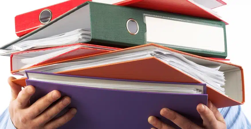 How Bookkeeping Consultancy Helps E-commerce Businesses Scale How bookkeeping consultancy helps e commerce businesses scale, shown with an image of a person holding a stack of colorful binders.v