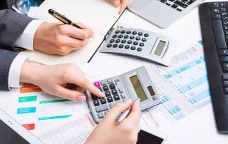 The Importance of Budget Reports illustrated with financial charts, graphs, and a business team analyzing data.